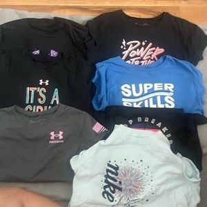 7 youth girls shirts size large 10/12, 6 Under Armour , 1 Nike